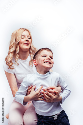 young modern blond curly mother with cute son together happy smiling family posing cheerful on white background, lifestyle people concept, sister and brother friends
