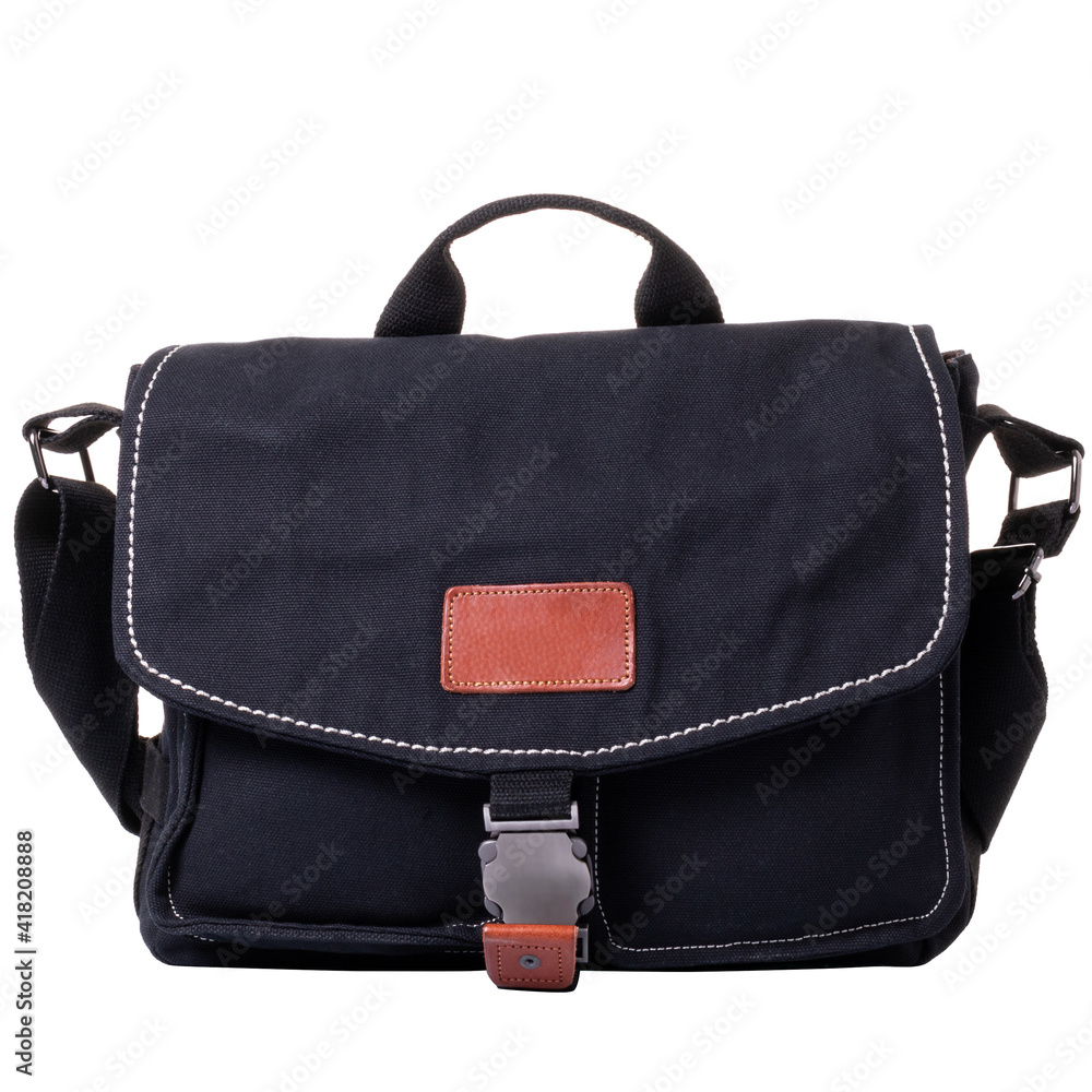 Men's bag made of black fabric. Bag with flap and metal lock. One handle and a wide textile shoulder strap. Men's bag made of black fabric. Bag with flap and metal lock. One handle and a wide textile shoulder strap.