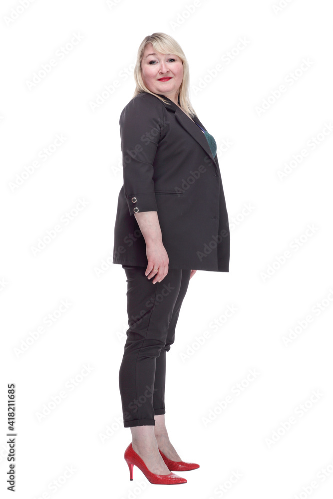 smiling mature woman in a pantsuit looking at you. smiling mature woman in a pantsuit looking at you.