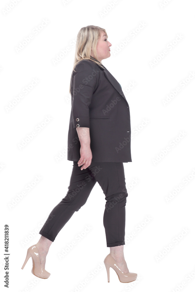 confident woman in a summer pantsuit striding forward confident woman in a summer pantsuit striding forward