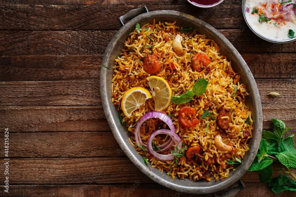 Homemade Prawn Shrimp biryani served with Yogurt Raita and beet pickle Homemade Prawn Shrimp biryani served with Yogurt Raita and beet pickle