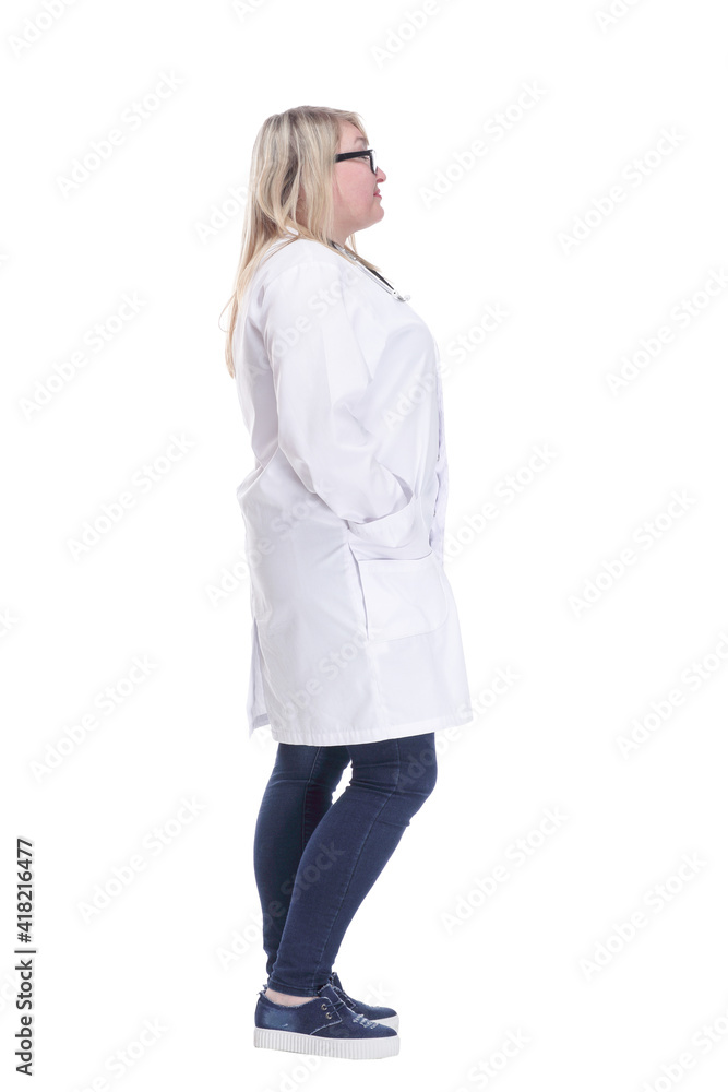Mature female doctor with a stethoscope looking at a white screen. Mature female doctor with a stethoscope looking at a white screen.