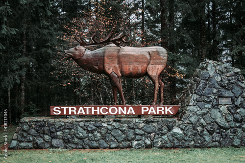 View of welcome sign Strathcona Park with forest in the background photo