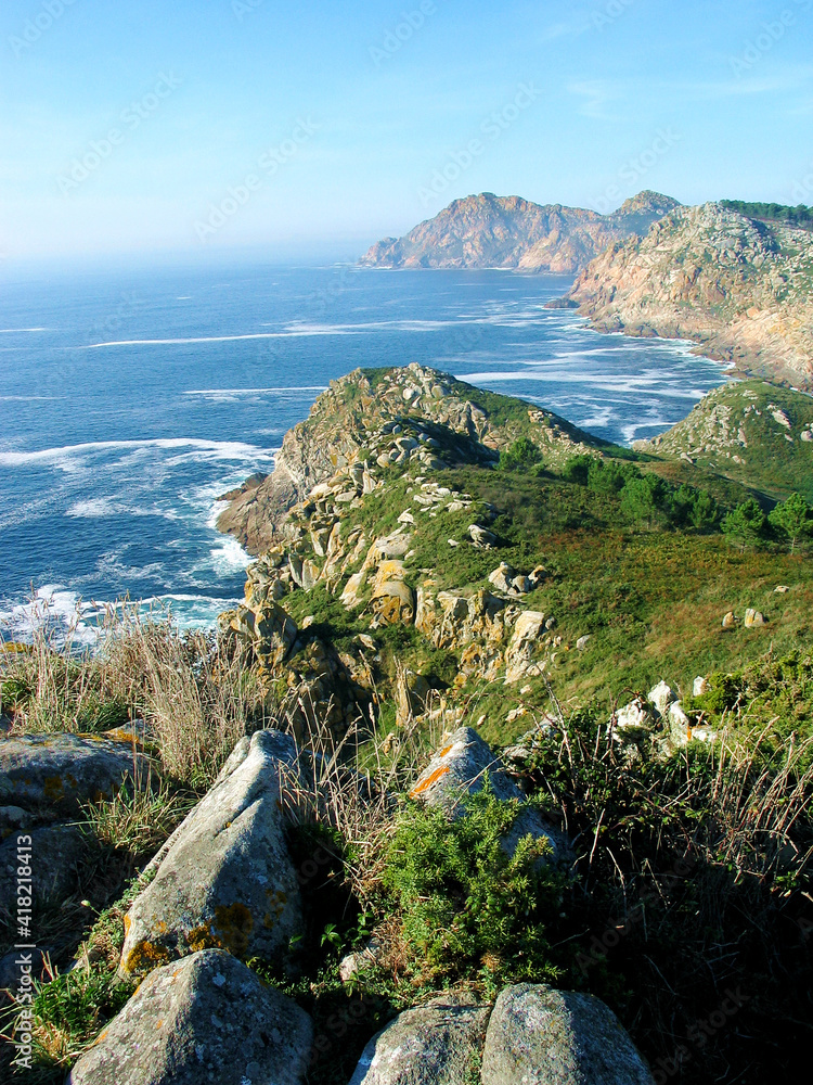 Landscape in Islas Cies, Galicia,Spain, Europe: volcanic islands, rocky shores and turbulent water with sea foam and waves.