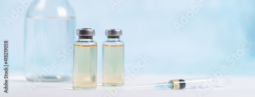 vaccine and medical masks on a white background, banner covid 19