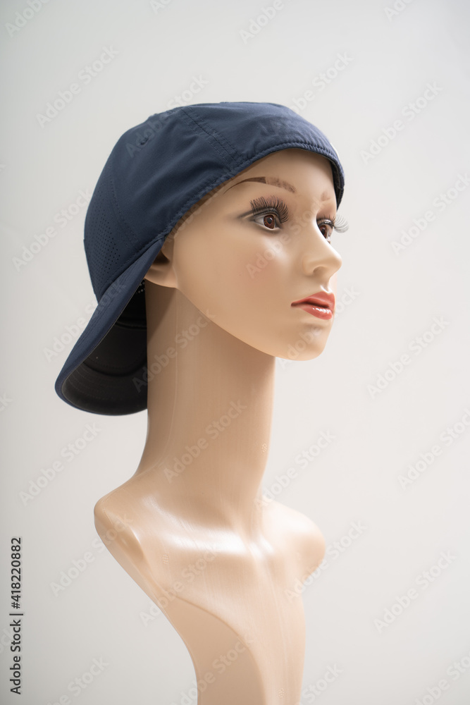 Mannequin wearing a cap in front of the white background Mannequin wearing a cap in front of the white background