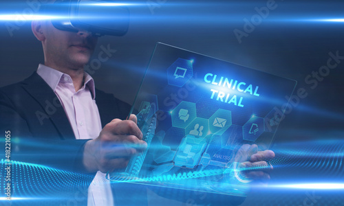 Fototapeta Naklejka Na Ścianę i Meble -  Business, Technology, Internet and network concept. Young businessman working on a virtual screen of the future and sees the inscription: Clinical trial