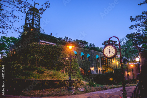 Beautiful view at night in park in Tokyo with Ghibli Museum, lights, watch and sky, Tokyo, Japan photo
