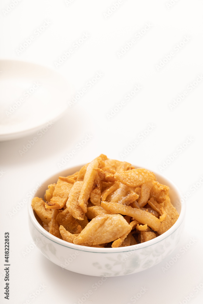 Fresh fried pork dregs on a pure white background Fresh fried pork dregs on a pure white background