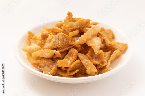 Fresh fried pork dregs on a pure white background