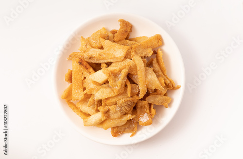 Fresh fried pork dregs on a pure white background