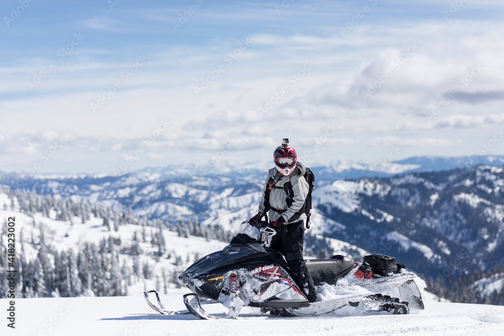 Snowmobiling on mountain