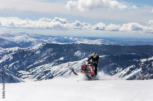 Snowmobiling on mountain