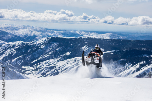 Snowmobiling on mountain