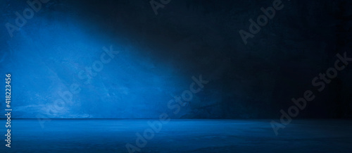 Blue concrete wall and floor with light and shadow backgrounds, use for product display for presentation and cover banner design.