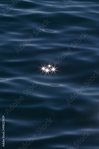 Stars in a sea. Sun reflection on woter surface. © o.nelika