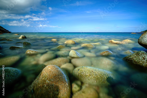 long exposure picture  at Ao Hin Ngam bay rock beach  clear water beach  blue sky on summer   baan Chaloklum  koh pha ngan  Suratthani  south of thailand