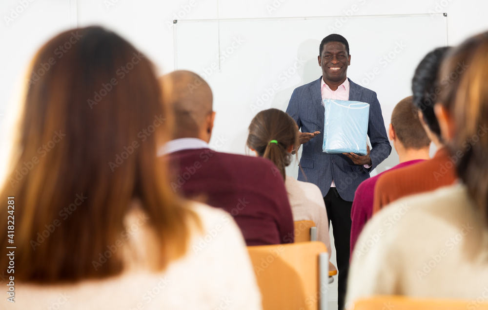 An entrepreneur advertises product at a business training