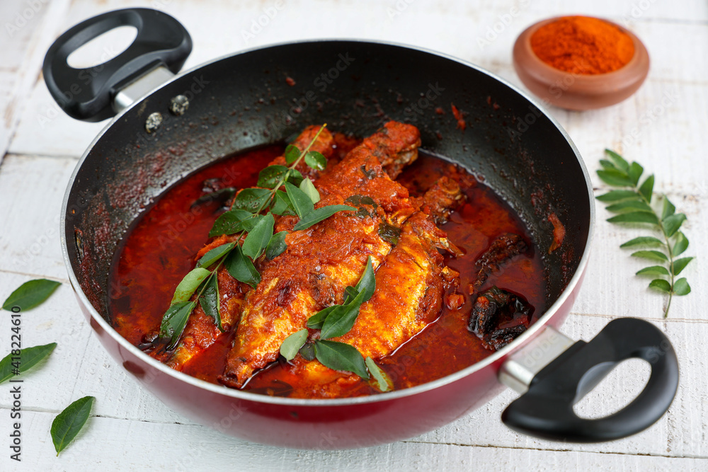 Spicy Mackerel fish curry gravy , cooking spicy Kerala fish curry