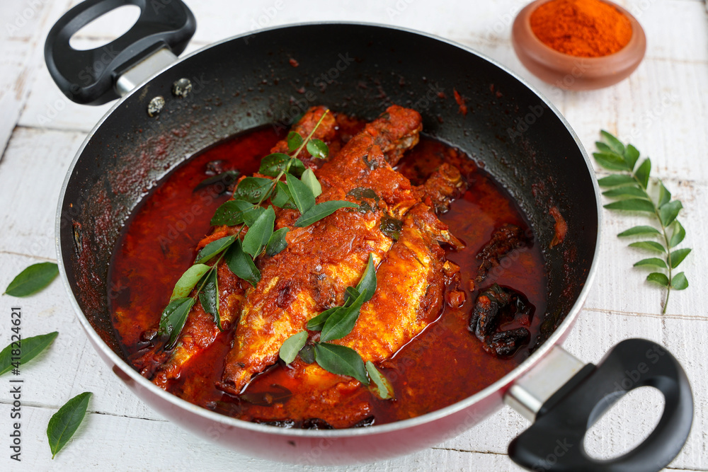 Spicy Mackerel fish curry gravy , cooking spicy Kerala fish curry