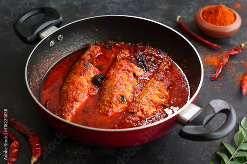 Spicy Mackerel fish curry gravy , cooking spicy Kerala fish curry , Goan red fish curry , Indian fish curry Bengali fish masala curry Kolkata, India Sri Lanka. Lankan food