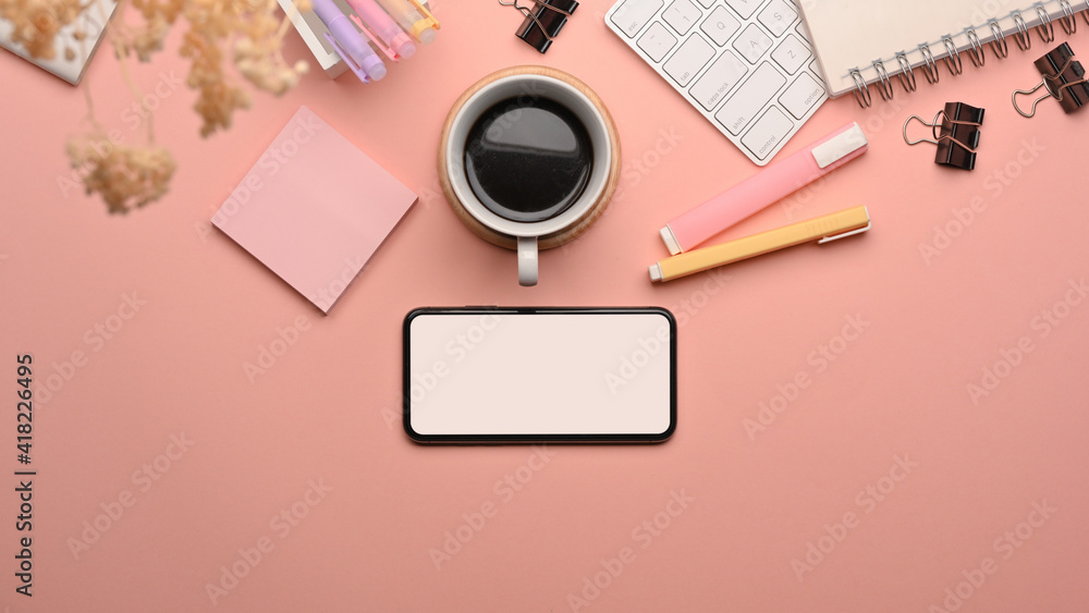 Study table with smartphone, computer keyboard, coffee cup and school elements Study table with smartphone, computer keyboard, coffee cup and school elements