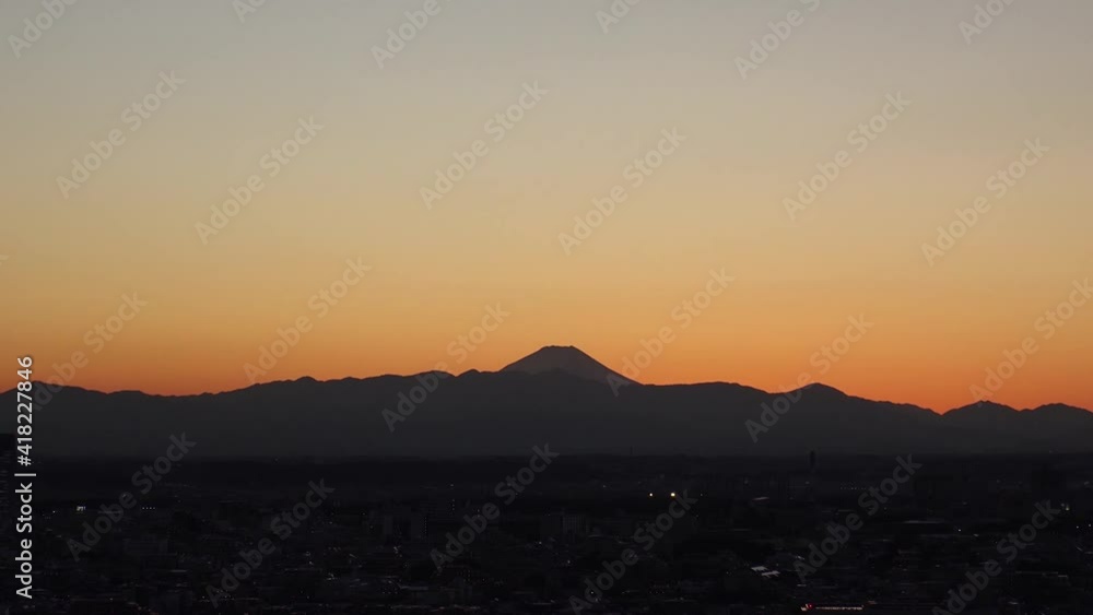 TOKYO, JAPAN : Aerial sunrise CITYSCAPE of TOKYO and MOUNT FUJI. View of rising sun, dawn sky and buildings. Japanese city life and nature concept. Time lapse zoom in video, night to early morning. TOKYO, JAPAN : Aerial sunrise CITYSCAPE of TOKYO and MOUNT FUJI. View of rising sun, dawn sky and buildings. Japanese city life and nature concept. Time lapse zoom in video, night to early morning.