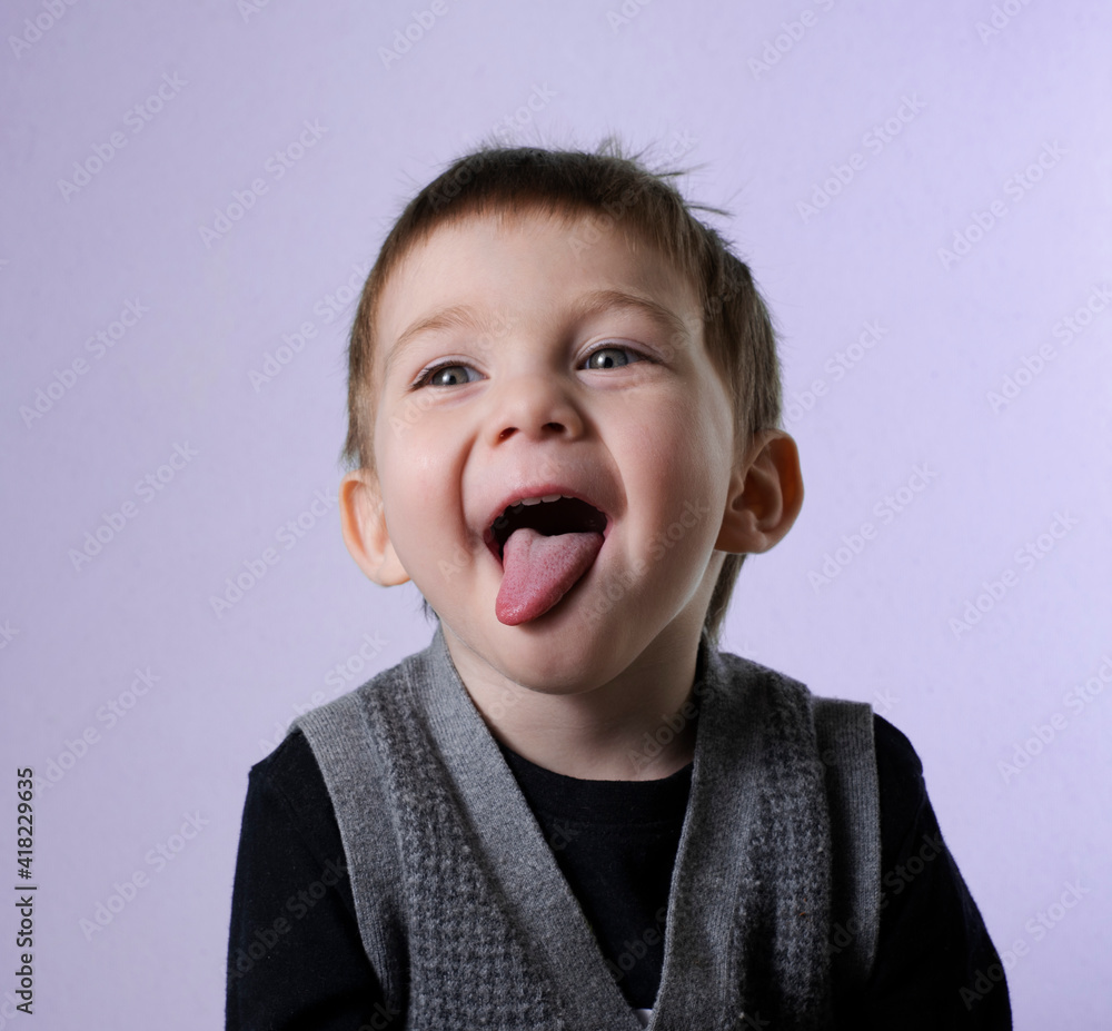 Two year old boy smiling with tongue sticking out Two year old boy smiling with tongue sticking out