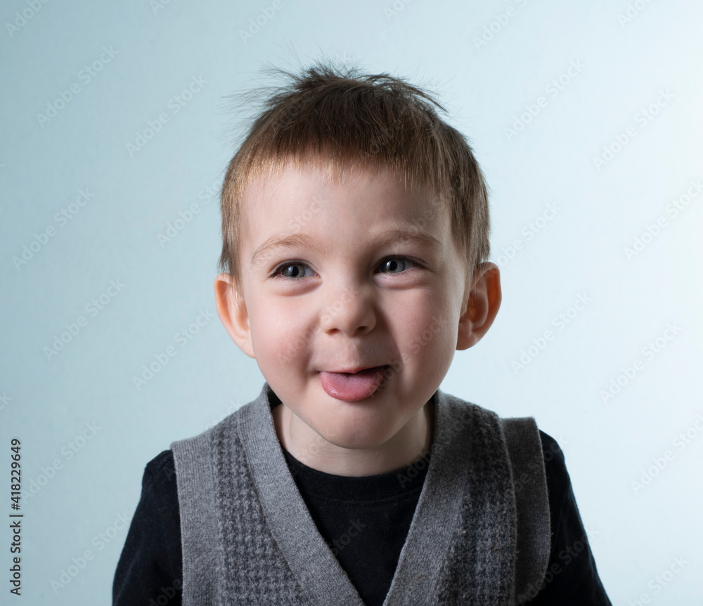 Two year old boy smiling with tongue sticking out Two year old boy smiling with tongue sticking out