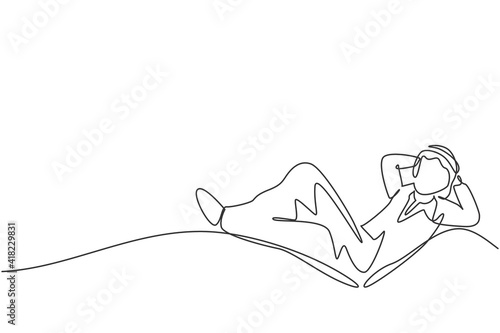 Single one line drawing young Arab male investor entrepreneur sleeping relax to dream his investments. Business growth minimal concept. Modern continuous line draw design graphic vector illustration