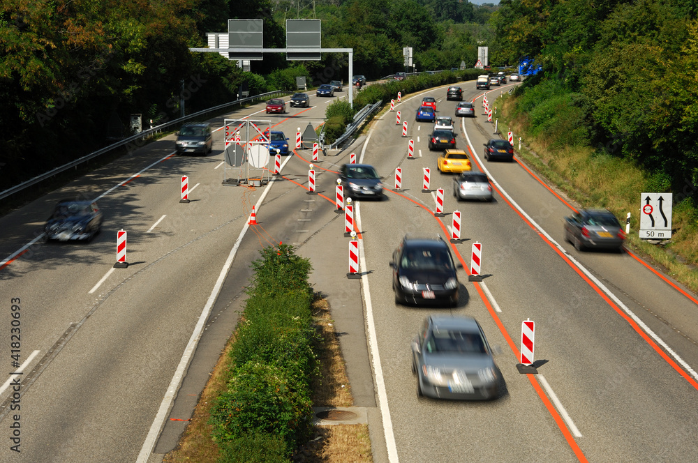 Motion-blurred Vehicles On A Highway In Road Narrowing Segment