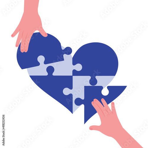 hands holding jigsaw, Hand putting the last piece of shape heart concept.