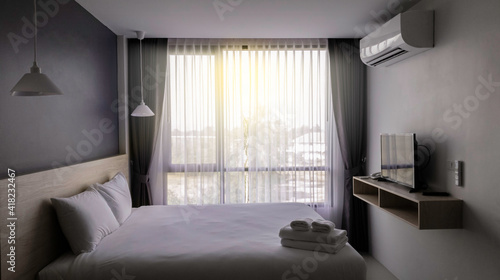 Bedroom comfortable interior design in the morning, Compact hotel room with facility accomodation