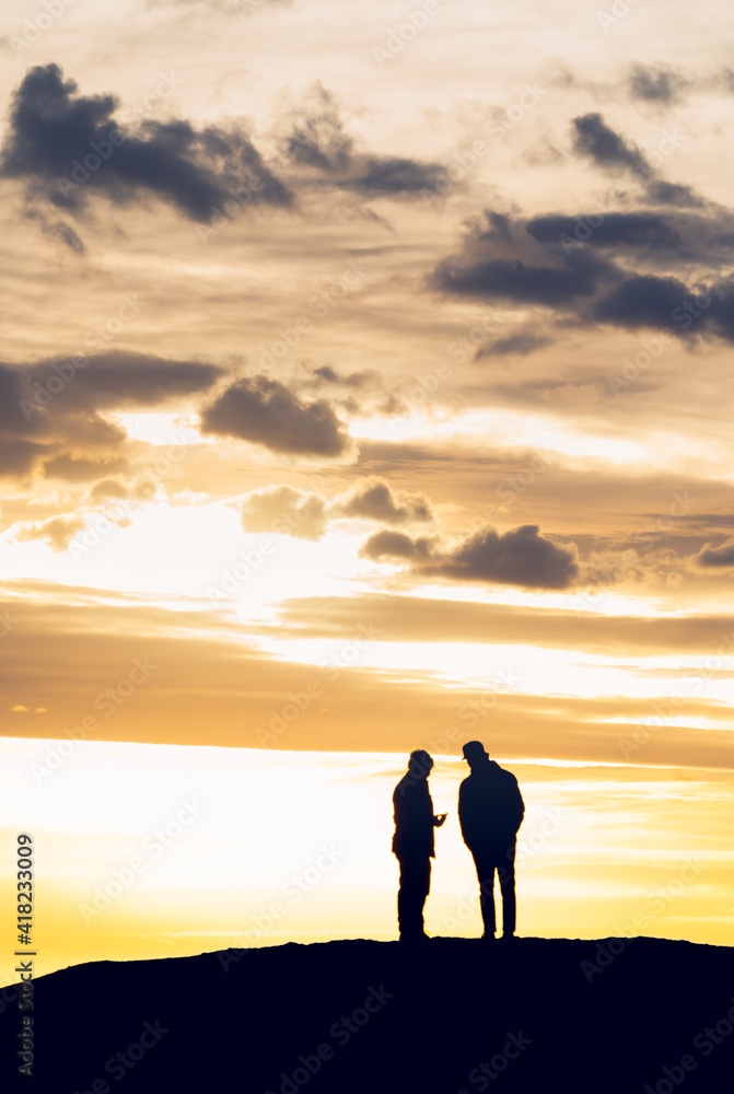 two guys taking in sunset view