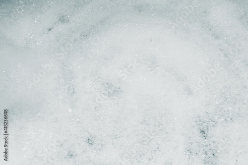 Texture of dish soap bubbles and foam; background of shampoo bubbles