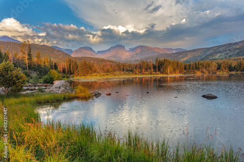 Sunrise on Hallett Peak and Flattop Mountain above Sprague Lake in Rocky Mountain National Park, Colorado, USA