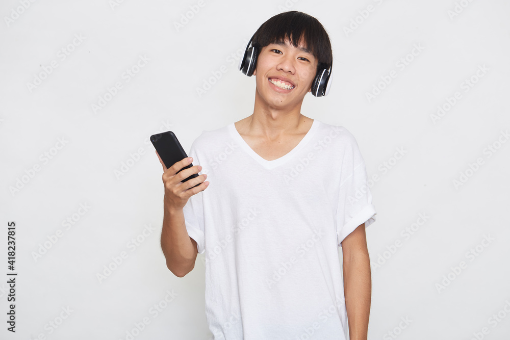 man wearing headphones from a smartphone man wearing headphones from a smartphone