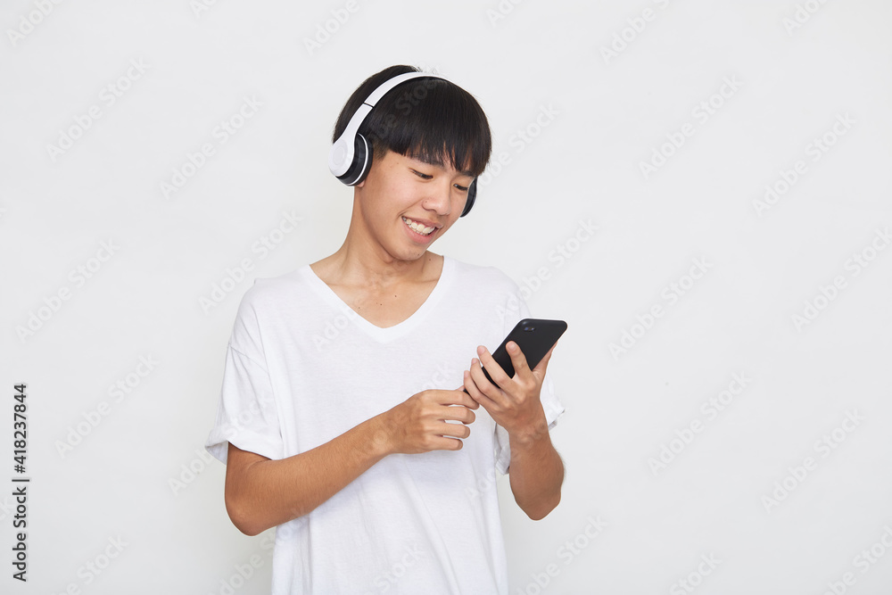 man wearing headphones from a smartphone man wearing headphones from a smartphone