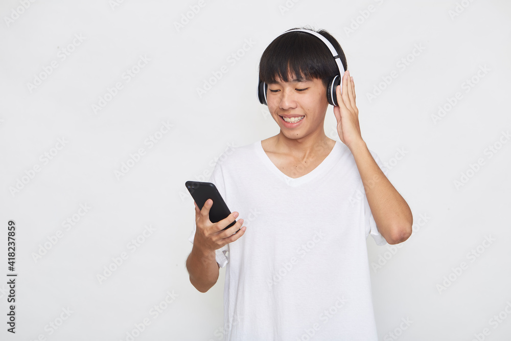 man wearing headphones from a smartphone man wearing headphones from a smartphone