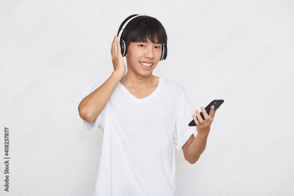 man wearing headphones from a smartphone man wearing headphones from a smartphone