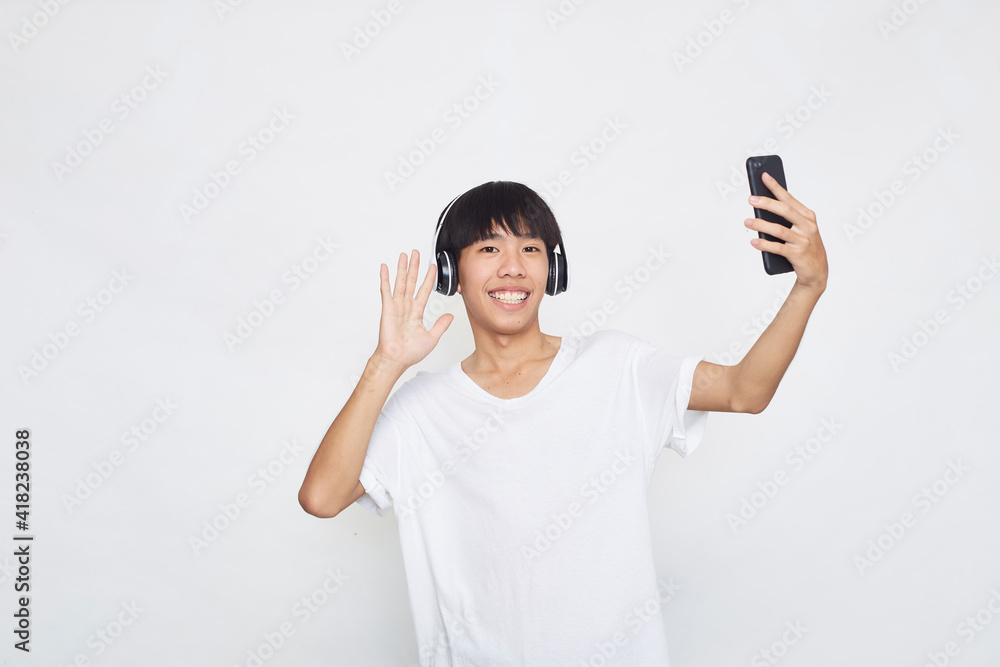 man wearing headphones from a smartphone man wearing headphones from a smartphone
