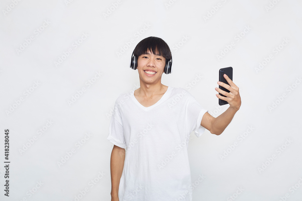 man wearing headphones from a smartphone man wearing headphones from a smartphone