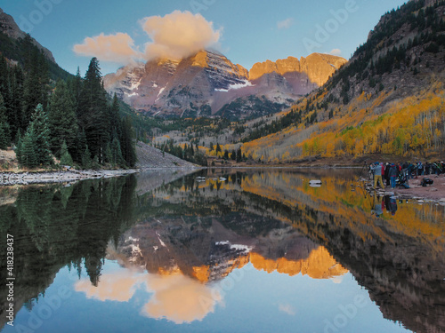 USA, Colorado, Maroon Bells. Mountain lake reflections in autumn sunrise.
