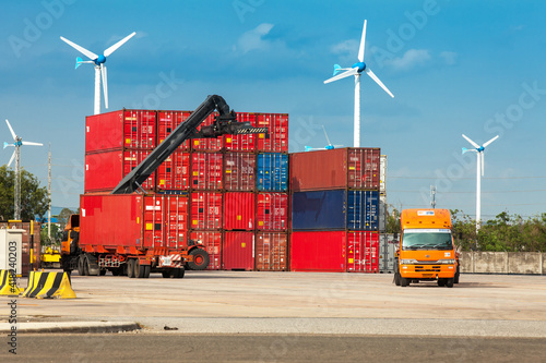 Bild auf Leinwand Crane lifter handling container box loading to truck in import export logistic z