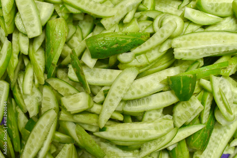 Coccinia grandis, ivy gourd known as scarlet gourd, Indian tindora, tindi, tendli and kowai fruit. Sliced, Diced and heap Coccinia grandis, ivy gourd known as scarlet gourd, Indian tindora, tindi, tendli and kowai fruit. Sliced, Diced and heap