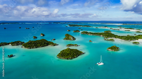 A spectacular drone image over Falaga Island in the lower Lau Group, Fiji showing a catamaran peacefully at anchor.