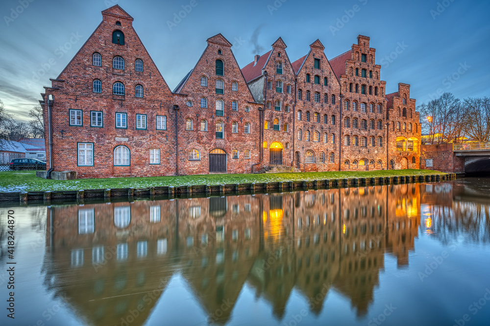 The historic Salzspeicher with the Trave river at dawn, seen in Luebeck, Germany