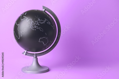 Modern globe on color background