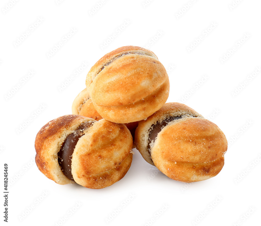 Tasty cookies with boiled condensed milk on white background