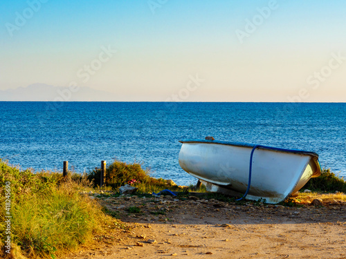 Fishing boat on sea shore